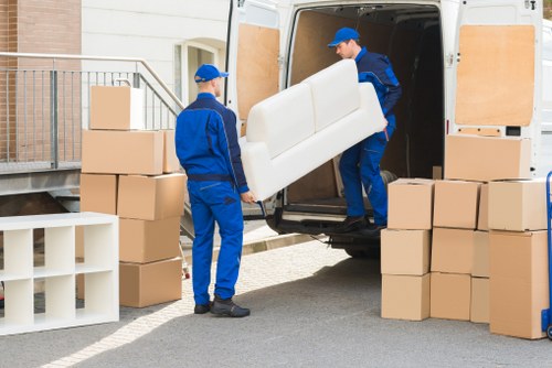 Trained storage team member handling items carefully